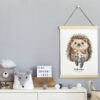 Stylish and cute scandinavian decor of child room with mock up poster, white shelf, natural toys, hanging kid measure basket for accessories and teddy bears. Minimalistic concept of interior.